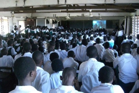 Students in a school in Accra attend a human rights education workshop, held by the Ghana Chapter of Youth for Human Rights International, with the guest speaker, International Development Director of Youth for Human Rights International.